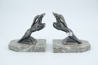 pair of art deco bookends of two hands reaching for each other