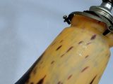 a close up of a yellow and black light fixture