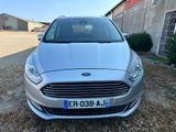 the front of a silver ford fiesta parked in front of a barn