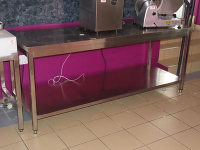 a kitchen with a counter and a mixer on the counter