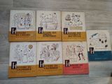 six books of french children ' s books are lined up on a table