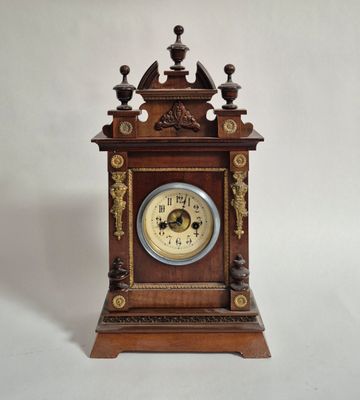 a wooden clock that is sitting on a table