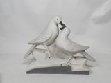 two birds that are sitting on top of a book