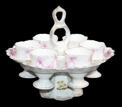 un bol blanc et rose orné d'un cygne