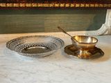 two bowls and a spoon sitting on a table