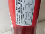 a close up of a red bottle with a label on it