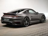 the porsche 9117 is parked in a garage with a checkered floor