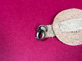 a piece of fabric with a button attached to it