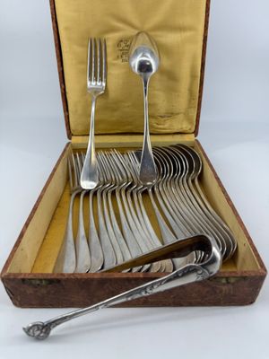 a wooden box with a set of silverware in it