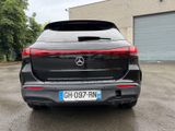 the rear end of a black mercedes suv parked in a parking lot