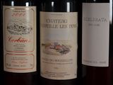 several bottles of wine are lined up on a table