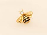 a close up of a bee with a diamond on it ' s back