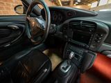 the interior of a sports car with a steering wheel and dashboard