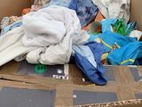 a cardboard box full of clothes in a store