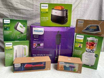 several boxes of philips appliances are sitting on a white surface