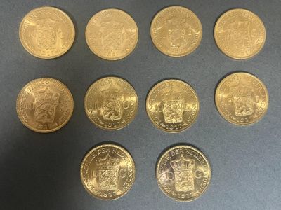six different types of gold coins are shown on a table