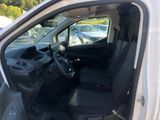 a white van with black seats in the back of it