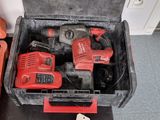 two tools in a case sitting on the floor