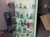 a display case with a lot of figurines on it