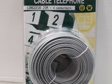 a close up of a white telephone cable on a white surface