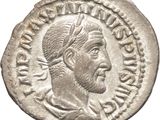 a silver coin with an image of a man in a turban