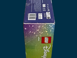 a box of toothpaste sitting on a blue surface