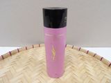 yves saint laurent body lotion in a bamboo basket on a table