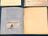 an open book with a picture of a person on a surfboard