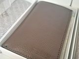 a box with a wallet inside of it on a table