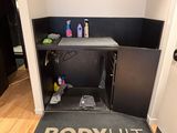 a doormat that says body hit in front of a door