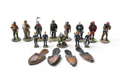 many figurines of different types of people on a white surface