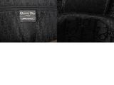 a close up of a black purse with a tag on it