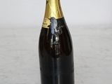 a bottle of champagne sitting on a marble counter top