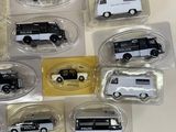 a lot of toy cars that are on display on the table