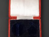 an image of a red and white box with a black and white lid