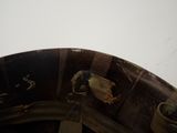 a close up of a hat with a bird on it