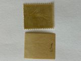 a stamp with a stamp on it next to a stamp with a stamp on it