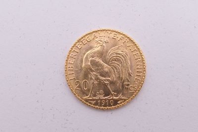 l'image d'une pièce d'or ornée d'un coq