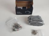 a box of screws and nuts sitting on a table