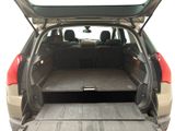 the back end of a car with the trunk open and the cargo tray in the trunk
