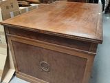 a wooden chest with a drawer on top of it