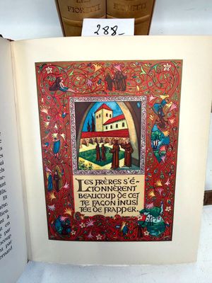 an open book with a picture of a castle on it