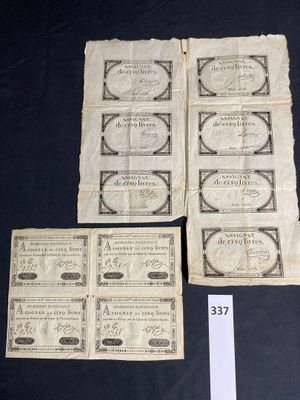 six old paper money bills are sitting on a black table