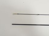 pair of black and gold metal fishing rods on a white surface