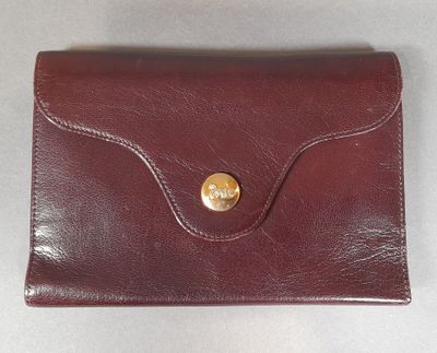 an image of a red leather wallet with a gold button