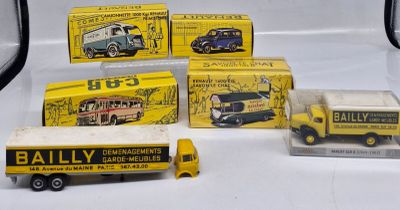 a lot of toy trucks that are sitting on a table