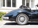 a black sports car parked in front of a building