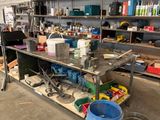 a workbench in a garage with a lot of tools on it