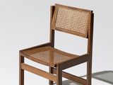 an image of a wooden chair with a woven seat and back
