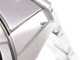 a close up of a watch on a white surface